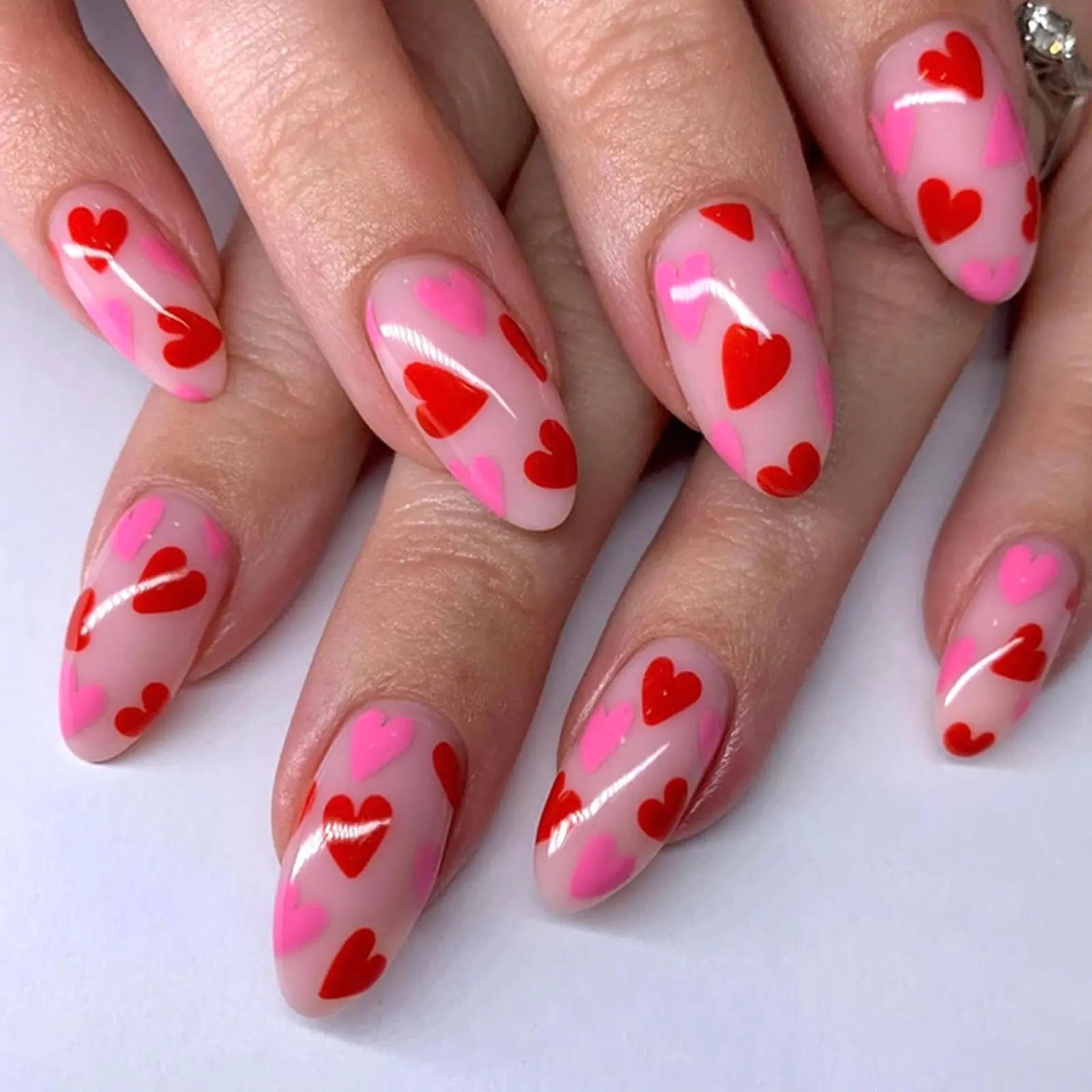 Medium Press on Nails Almond Valentines Fake Nails with Red Pink Heart Designs Glue on Nails Press ons Nude Full Cover False Nails Glossy Valentines Day Artificial Stick on Nails for Women 24Pcs
