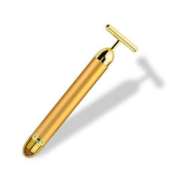 Gold facial roller for rejuvenating skin and enhancing beauty with luxurious skincare tools.