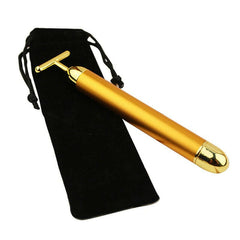 Gold facial roller for rejuvenating skin and enhancing beauty with luxurious skincare tools.