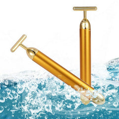 Gold facial roller for rejuvenating skin and enhancing beauty with luxurious skincare tools.