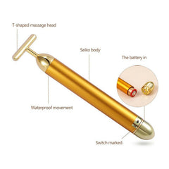 Gold facial roller for rejuvenating skin and enhancing beauty with luxurious skincare tools.