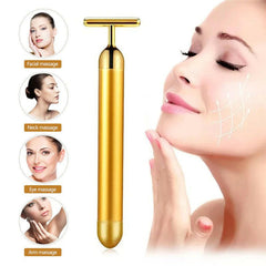 Gold facial roller for rejuvenating skin and enhancing beauty with luxurious skincare tools.