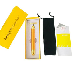 Gold facial roller for rejuvenating skin and enhancing beauty with luxurious skincare tools.